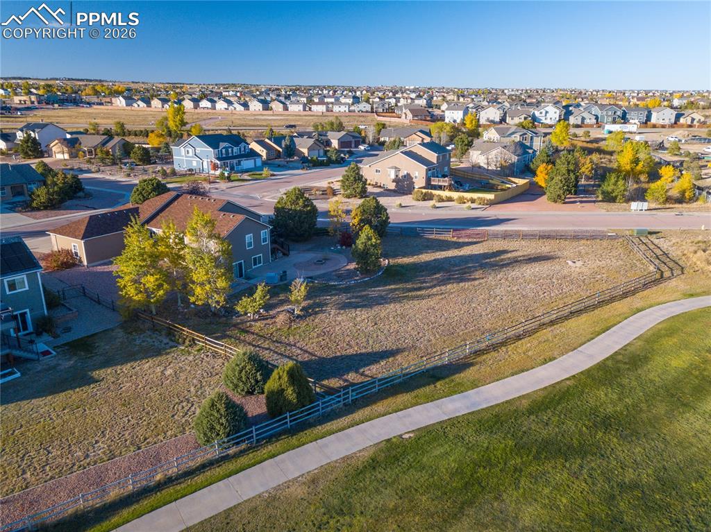 Aerial view of home looking from the south featuring mountains and Antler Creek Golf Course