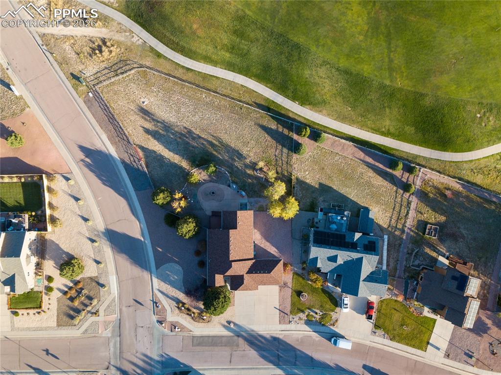 Aerial/overhead view of home looking from the east featuring mountains and Antler Creek Golf Course