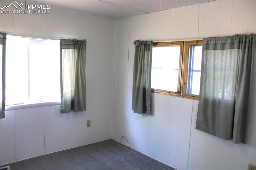 Unfurnished room featuring carpet flooring