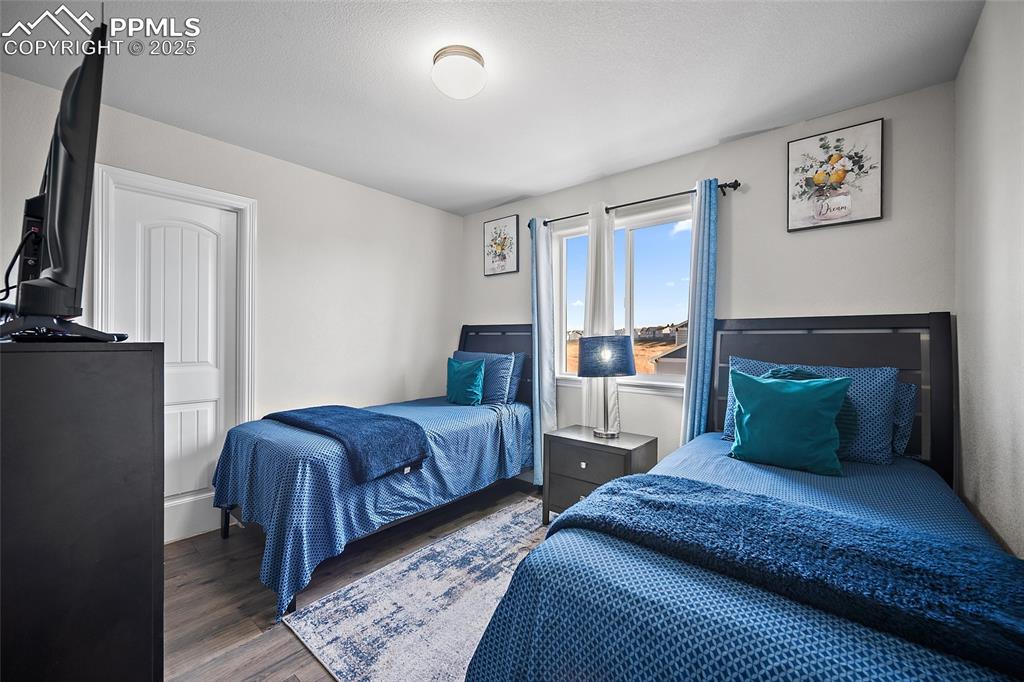 Bedroom with wood finished floors