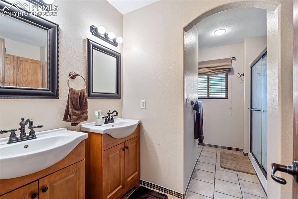 Updated full bathroom with modern vanity and lighting