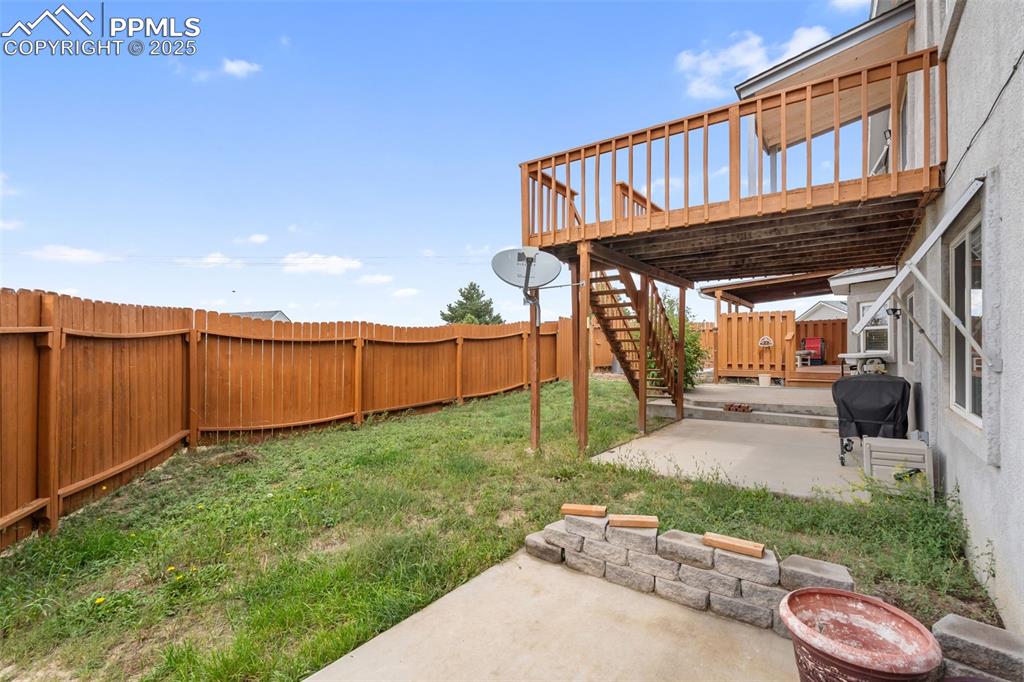 Fenced backyard with patio space