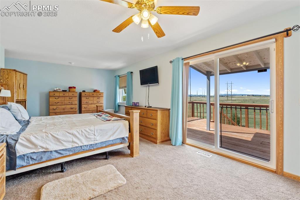 Upper-level master suite with private deck and mountain views