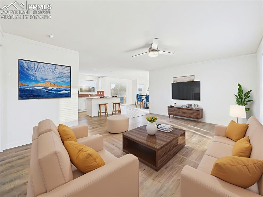 Virtually Staged This versatile great room connects effortlessly to the kitchen and dining areas, creating a cohesive flow for everyday life.