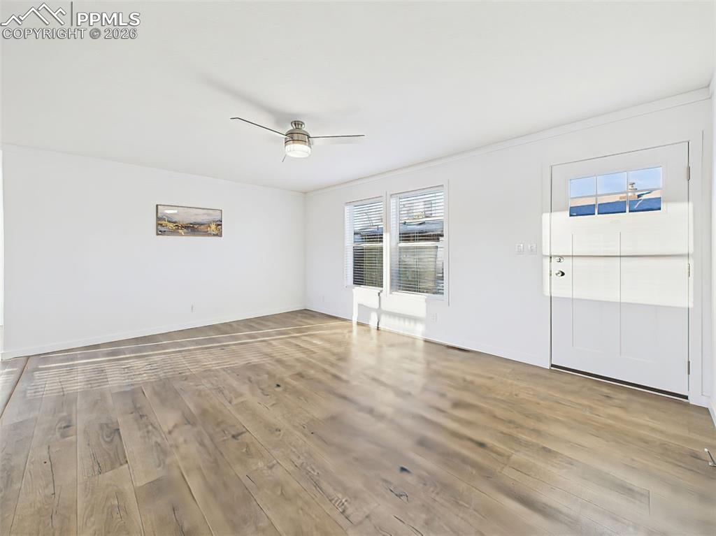 Open and flexible, this front living space offers great natural light and entryway access.