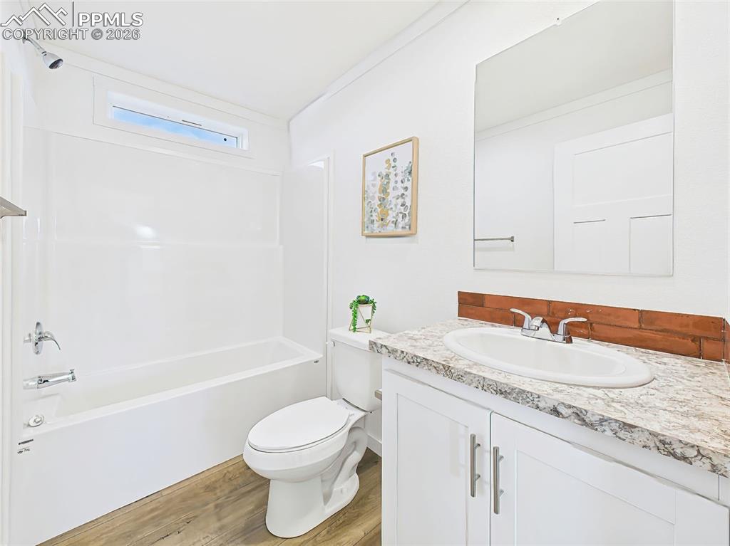 Crisp and clean with a full-size tub/shower combo, vanity with storage, and beautiful -style countertop.