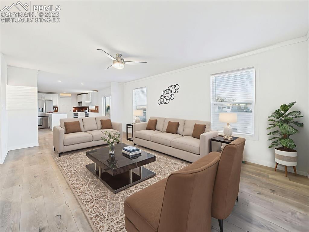 Virtually Staged This inviting living space connects beautifully to the kitchen, creating an open and functional layout that supports both everyday living and entertaining.