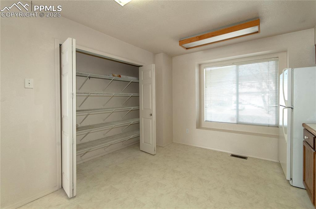 Kitchen features a large pantry