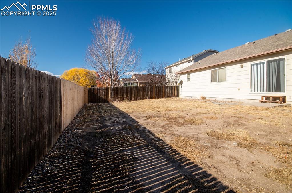 View of fenced backyard