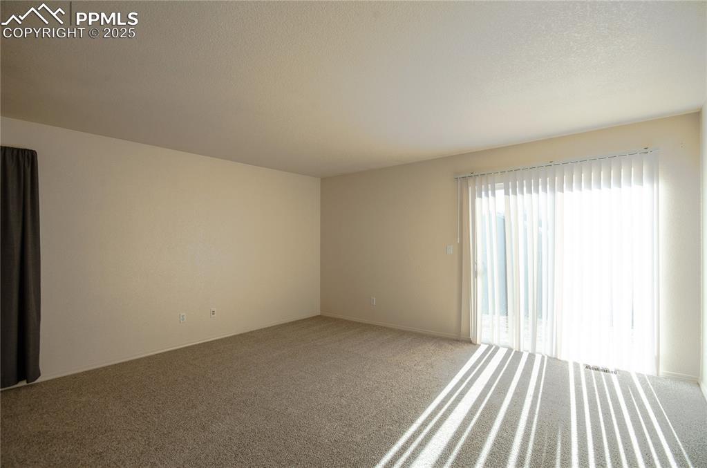 Living room with walk-out to the backyard