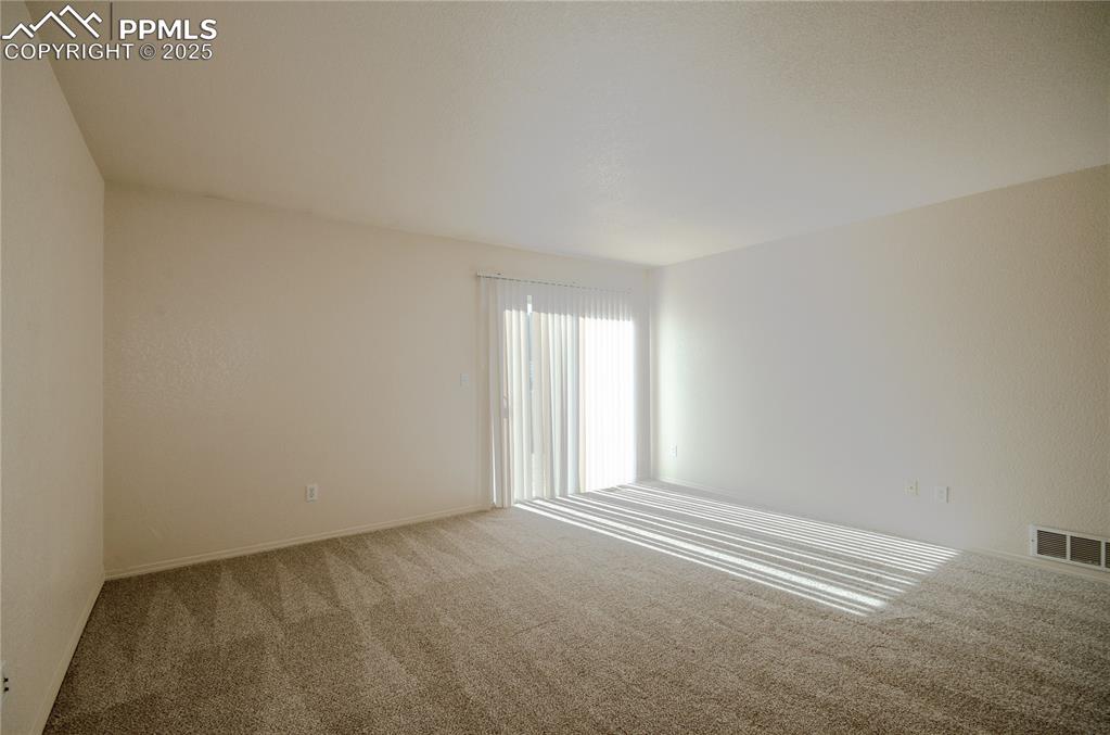 Living room and walk-out to the backyard