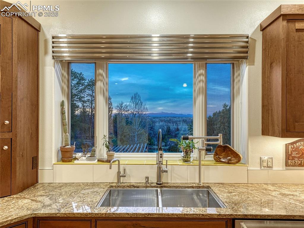One of two sink/dishwasher/prep spaces w/Pikes Peak views.