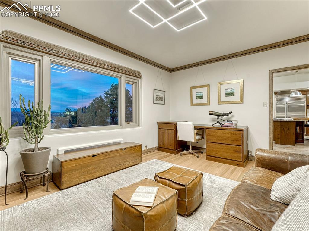 Informal dining space/office/lounge area connected to kitchen.