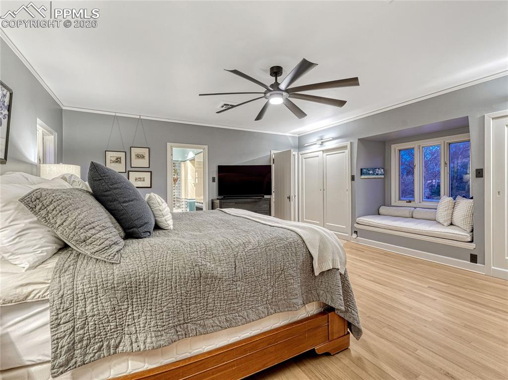 Primary Suite w/dual closets, window seat, dressing area w/additional wardrobe.