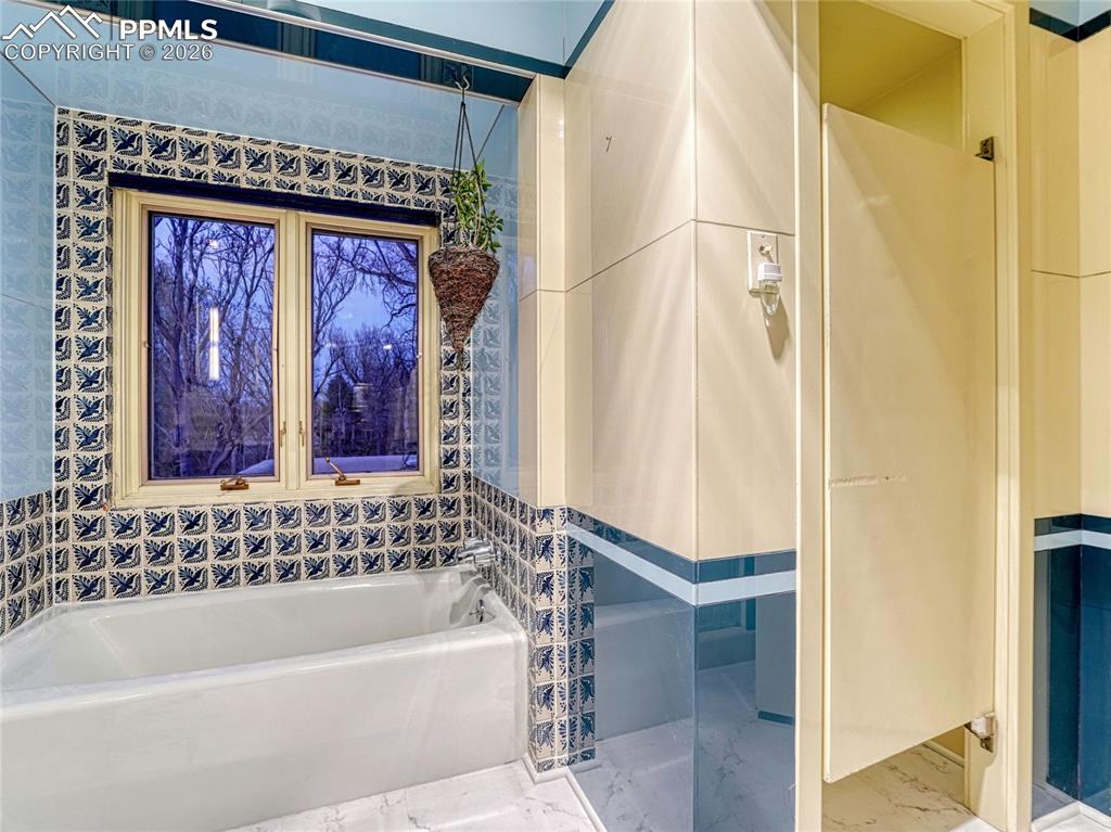 Original handpainted and Vitrolite tile.