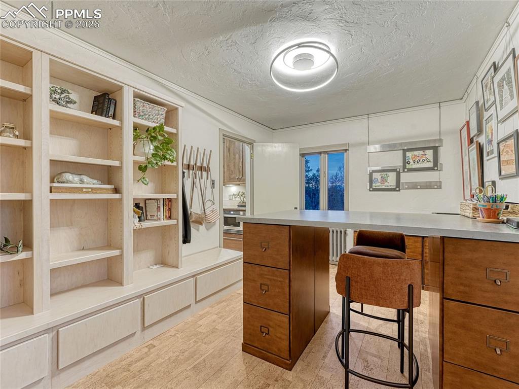 Bedroom/office on main level w/built-ins plus closet space and private bath.