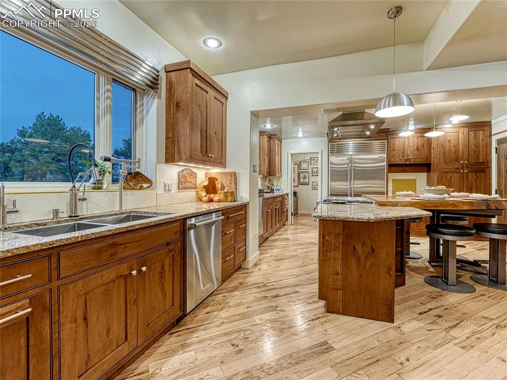 Expanded kitchen space with dual sinks, dual dishwashers and dual prep spaces.