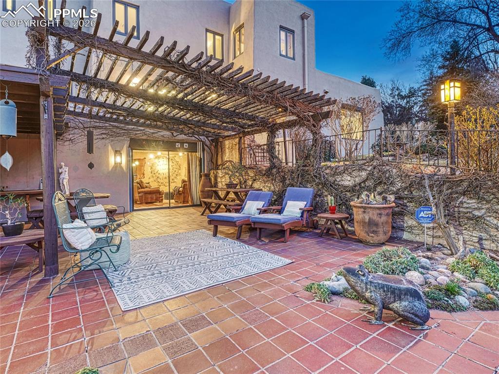 Draped in green-leaf vines over the summer months.