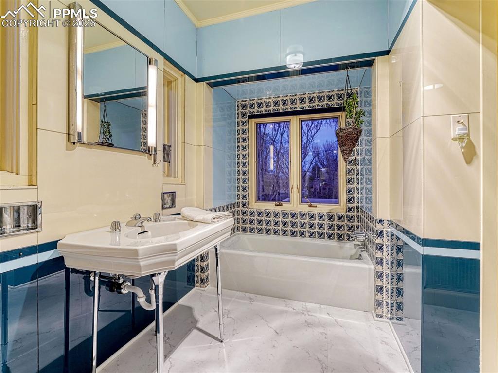 Primary ensuite with original 1939 sink and tile.