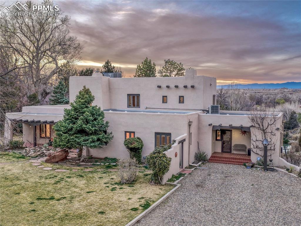 Front driveway with secondary entrance.