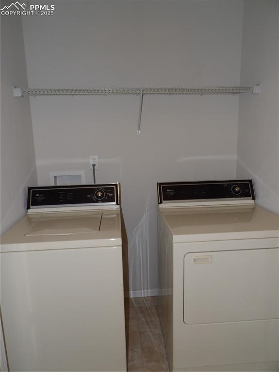 Laundry room featuring washing machine and clothes dryer