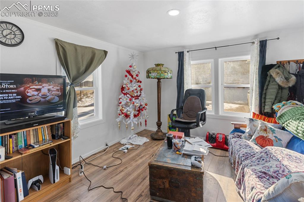The living area with wood finished floors and baseboards!