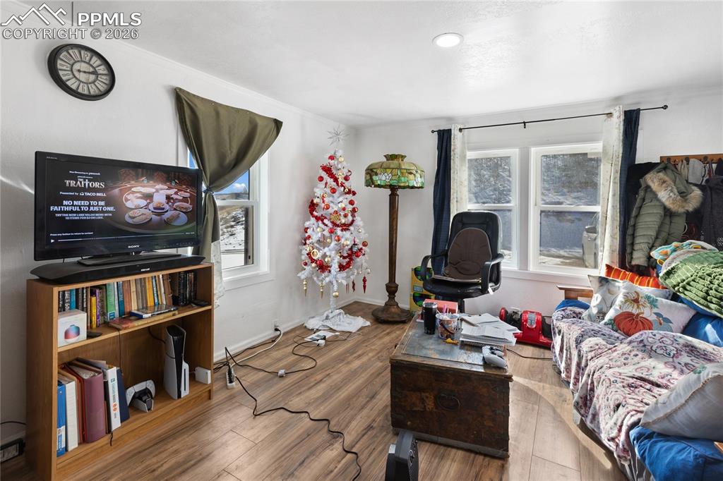 The living area with wood finished floors and plenty of natural light!