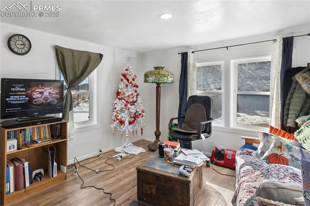 Living room with wood finished floors and baseboards