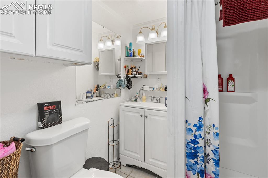 The full bath with a shower and vanity!