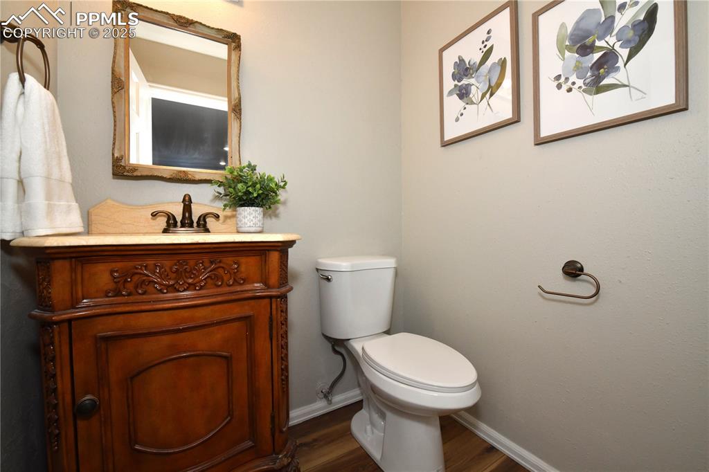 Bathroom featuring vanity and wood finished floors