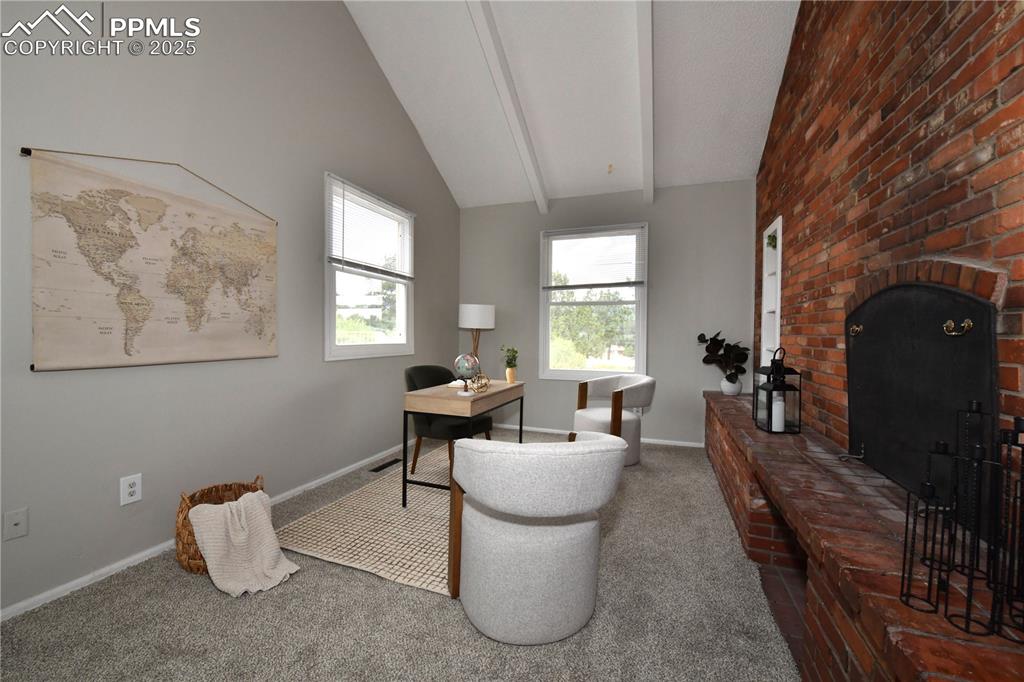 Carpeted office space with baseboards