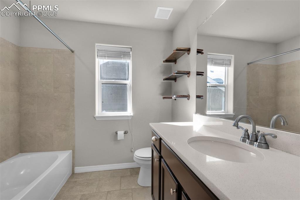 Full bathroom featuring vanity, shower / bathtub combination