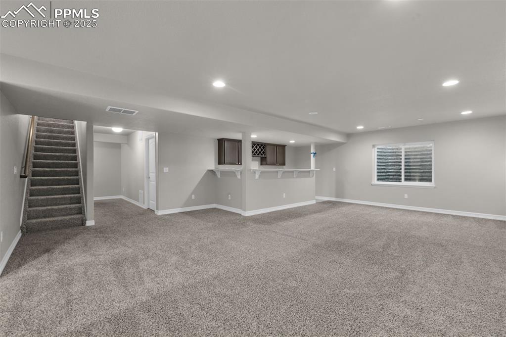Huge basement family room with wet bar 
