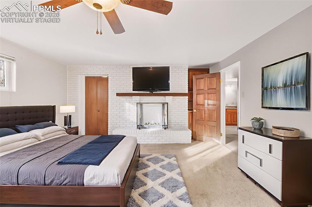 (Virtually Staged) – Large basement bedroom with fire place  walk in closet, ideal for guests or multi-purpose use.