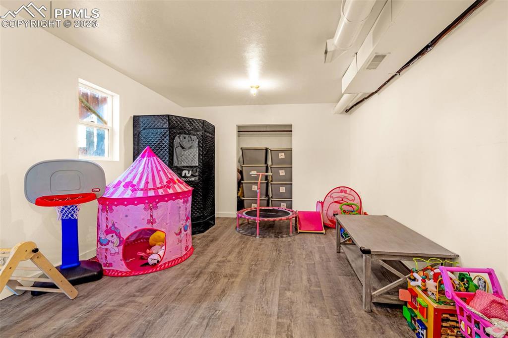 ADU- downstairs.
Office/Playroom featuring wood finished floors