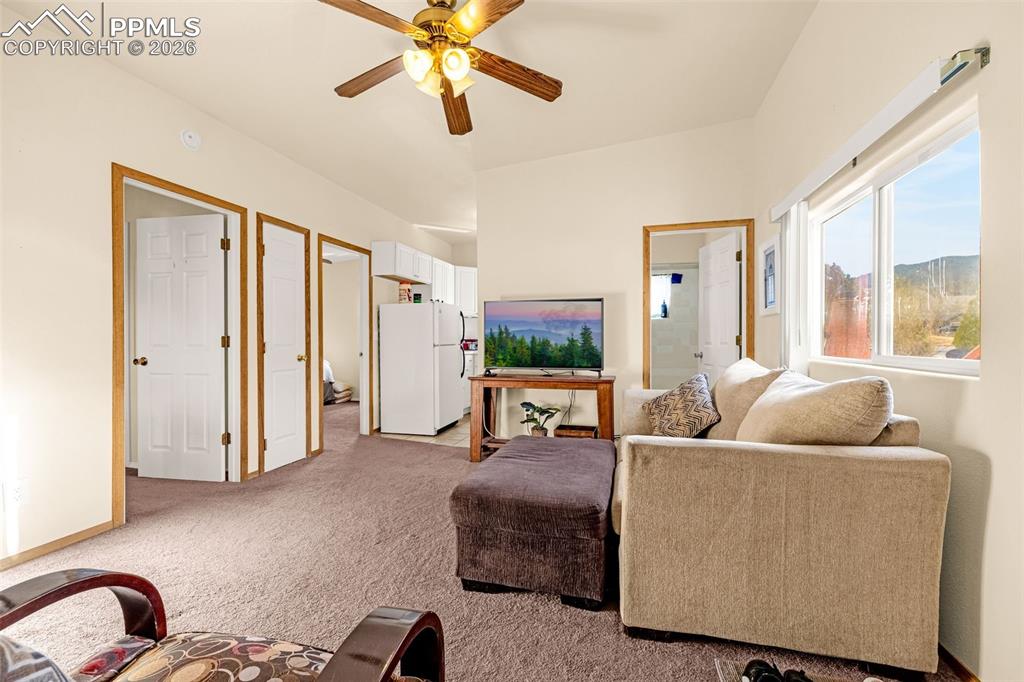 ADU Living area featuring light colored carpet and ceiling fan