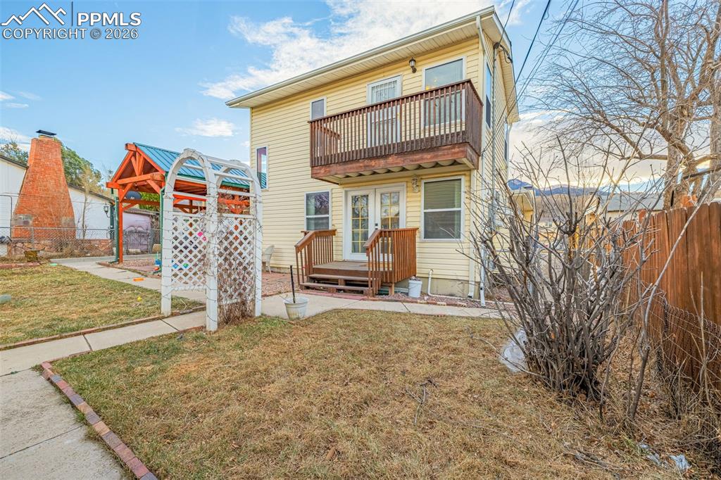 Back of house with a patio and french doors