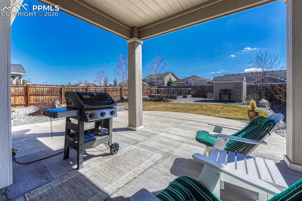 Partially covered patio with natural gas hook-up and grill included