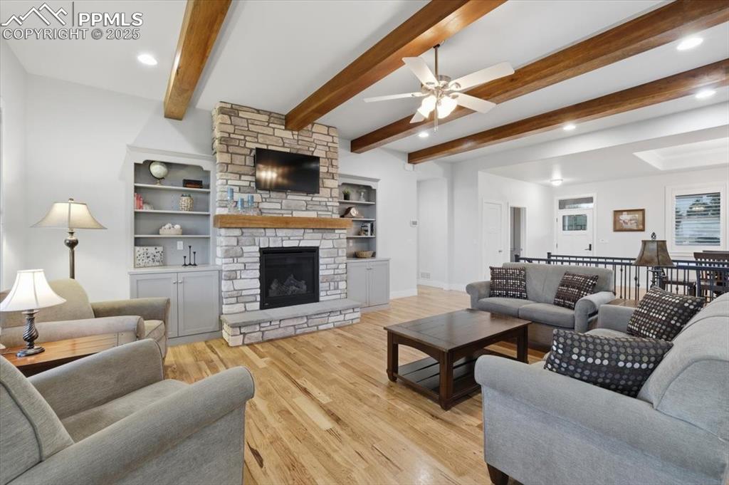 With built-ins and a stone-surround gas fireplace, this great room is cozy and inviting. 