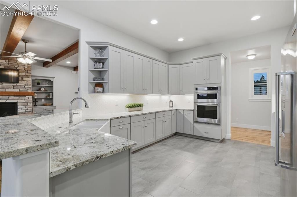 The kitchen is spacious and stylish, with a farmhouse sink, and a great work flow. 