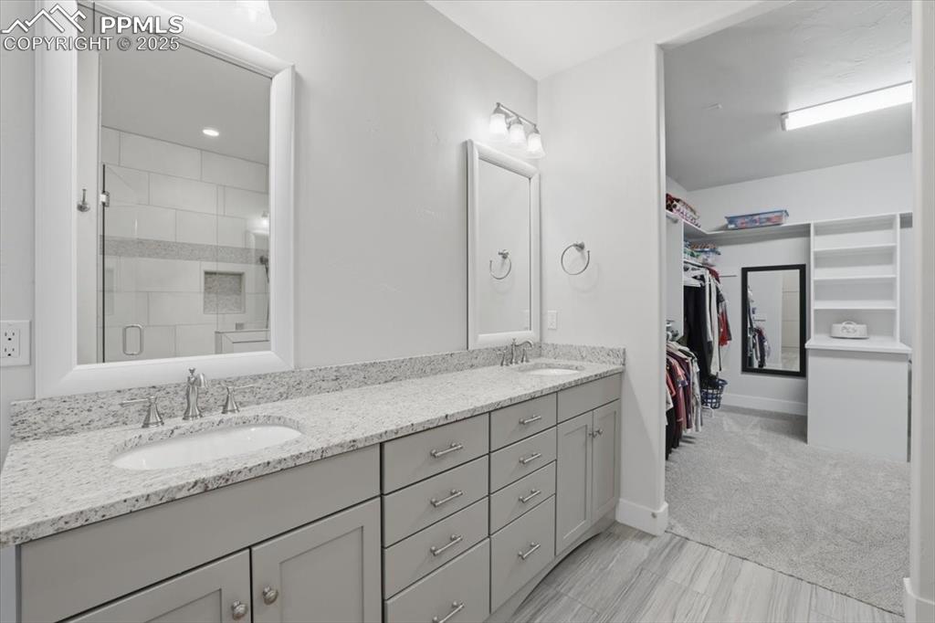 The primary bathroom connects to the HUGE walk-in closet. 