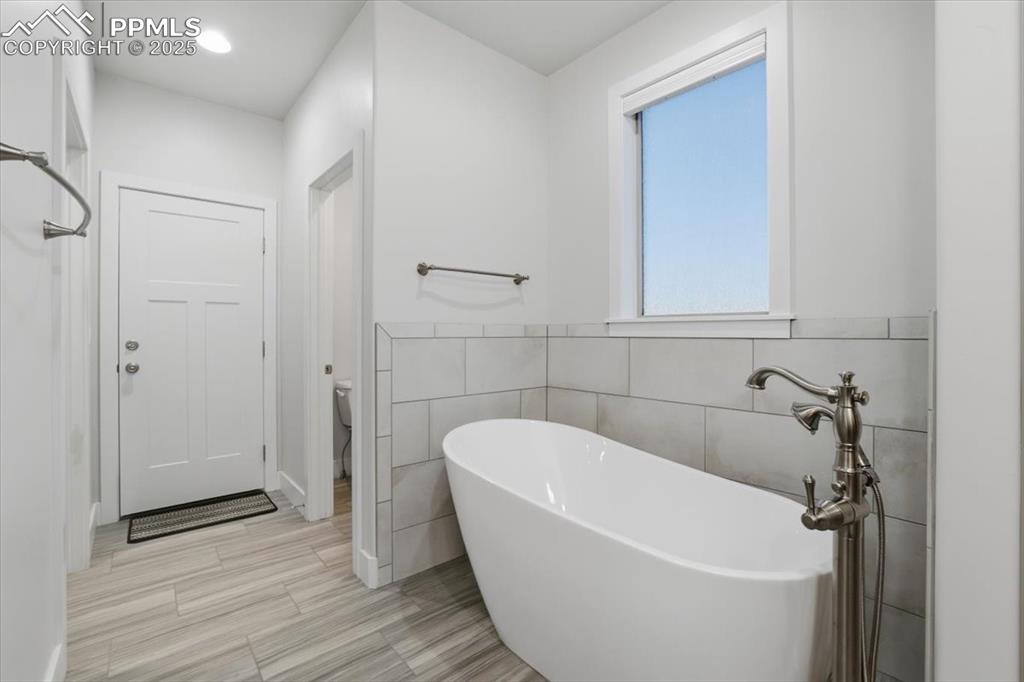 The primary bathroom is beautiful and elegantly finished, the perfect place to start and end your days. 