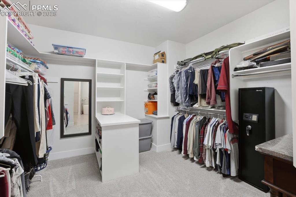 With built-ins and a peninsula, the walk-in closet makes it easy to organize your wardrobe. 