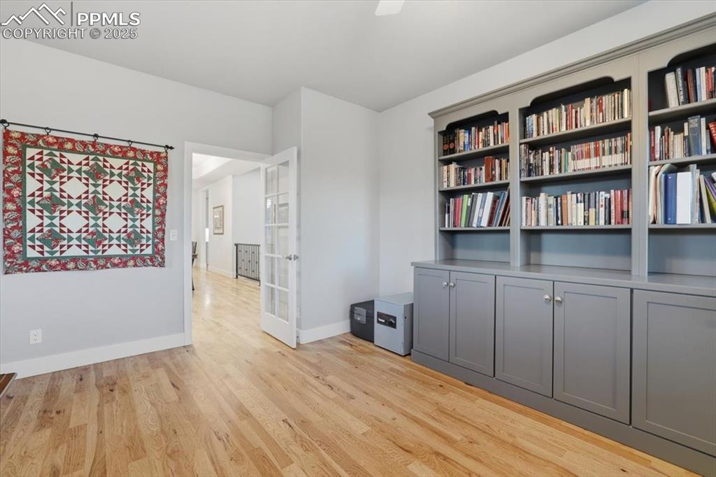 Built-ins and picture windows make this front office a great work-from-home space. 