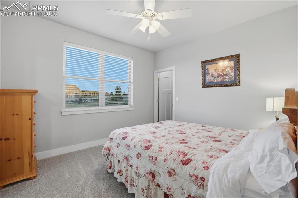 The second of three main-floor bedrooms has a walk-in closet.