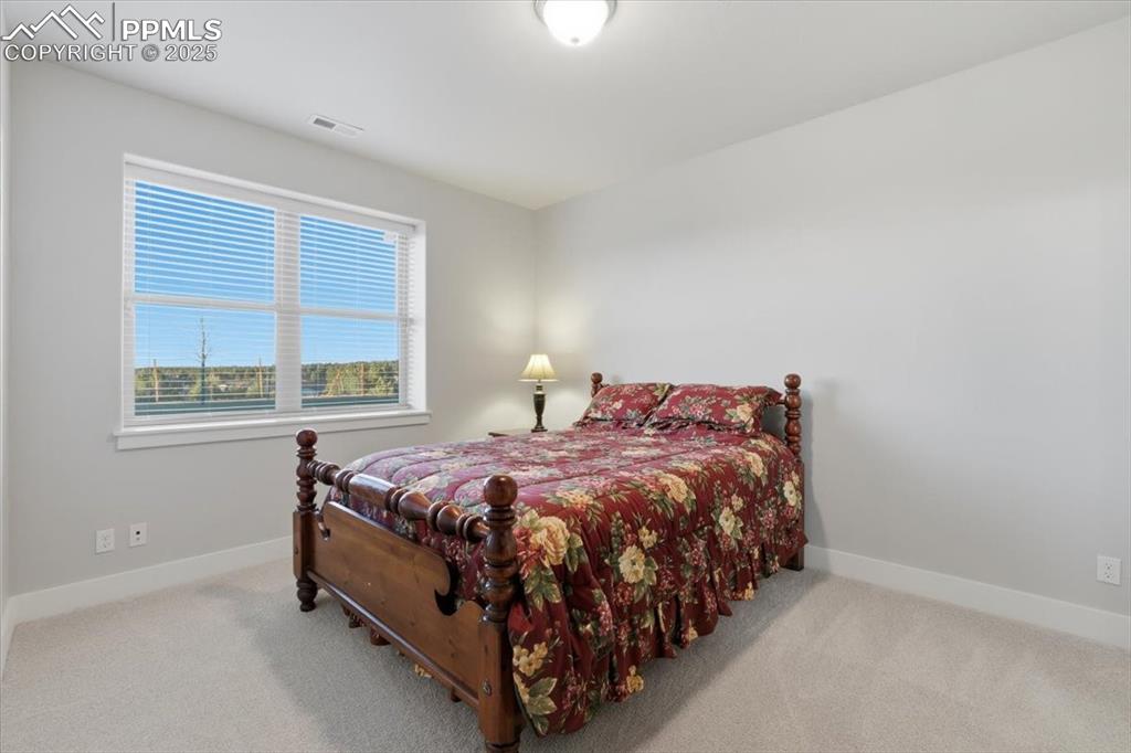 The fourth bedroom is located on the basement level, with a garden-level window. 