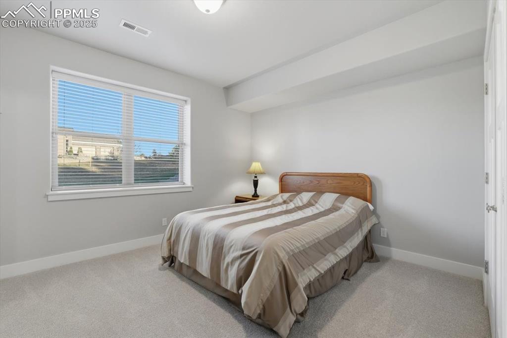 The fifth bedroom is located on the basement level, with a garden-level window. 