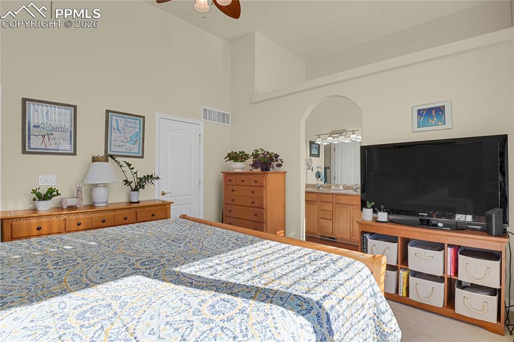 Primary bedroom showing door to walk-in closet & entry to Primary bathroom.
