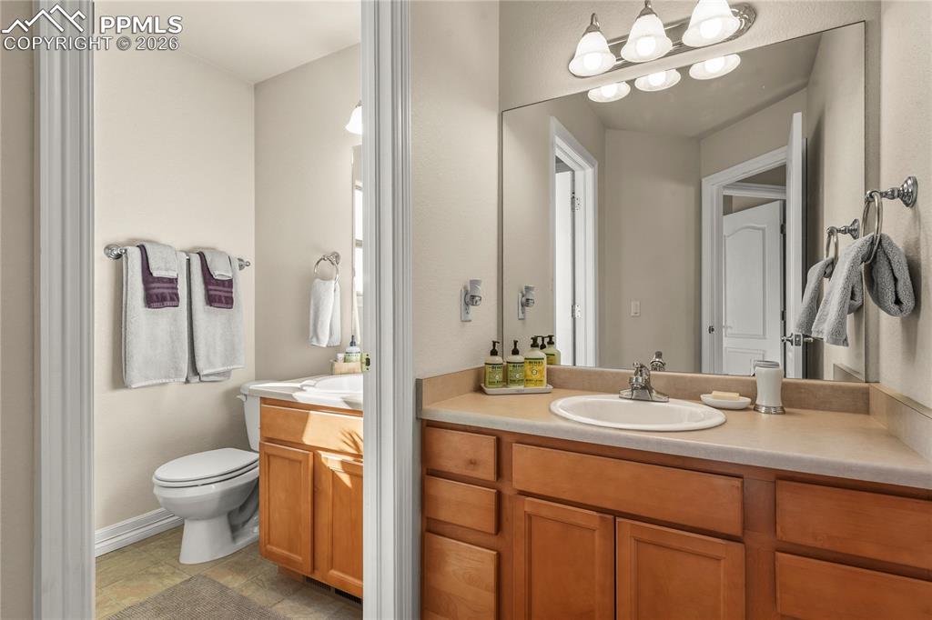 Upper level bathroom with tub.