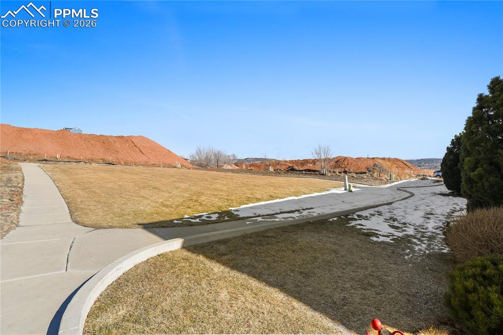 Play area,dog walking path directly behind this home.